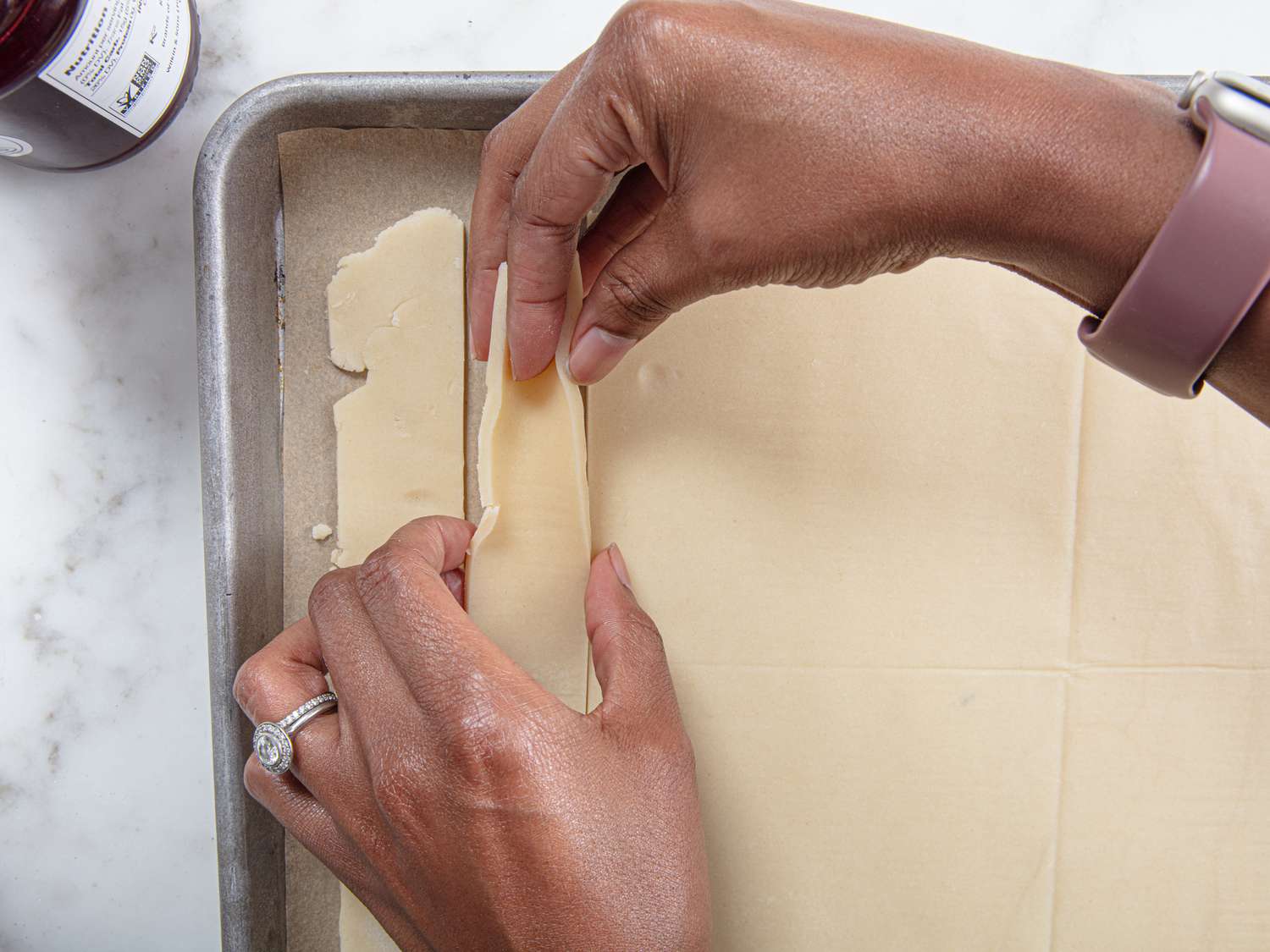 Overhead view of pinching dough