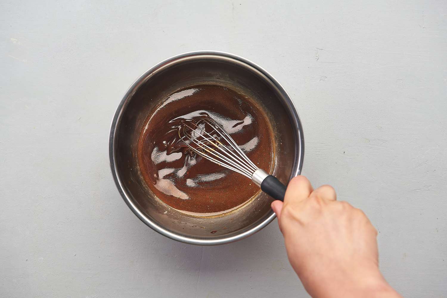 Sugar, soy sauce, oyster sauce, vinegar, sesame oil, wine, fish sauce, and cornstarch whisked together inside a medium bowl