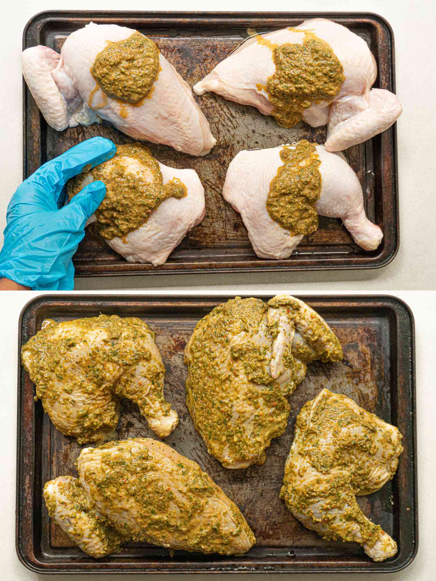 Seasoned chicken on a rimmed sheet pan.