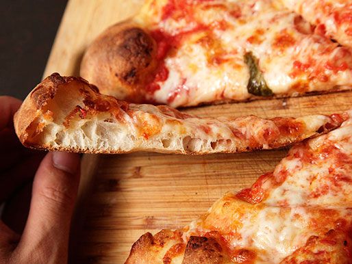 A slice of pizza that shows the side of the crust