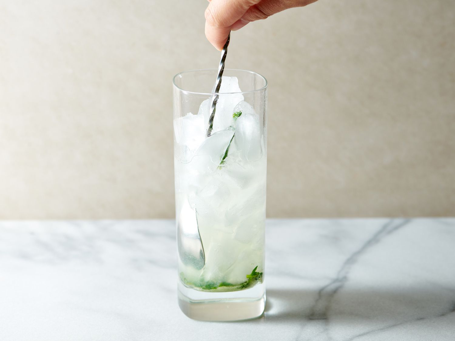 Glass filled with ice, with rum and lime juiced stirred in