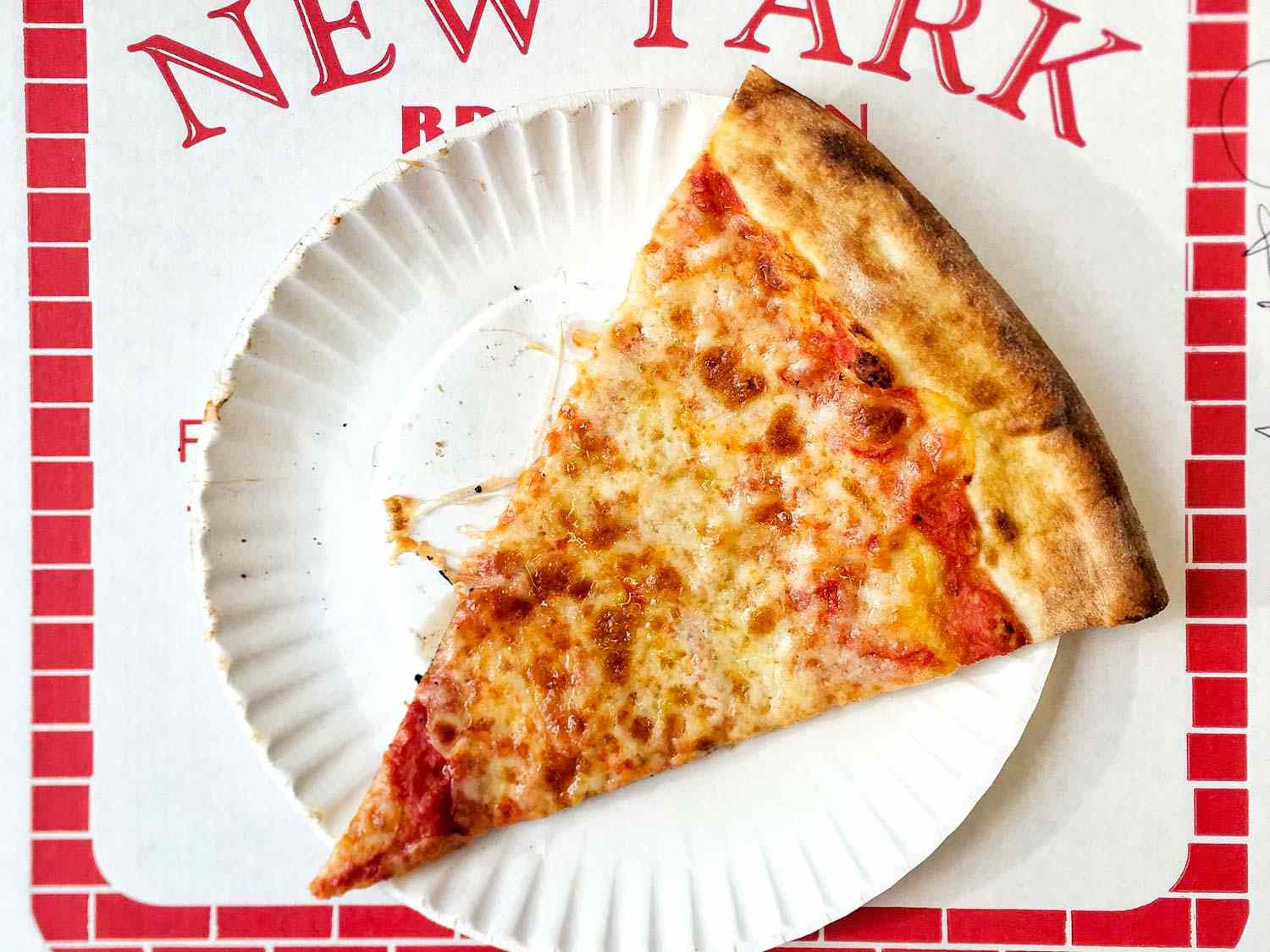 A slice of cheese from New Park Pizza