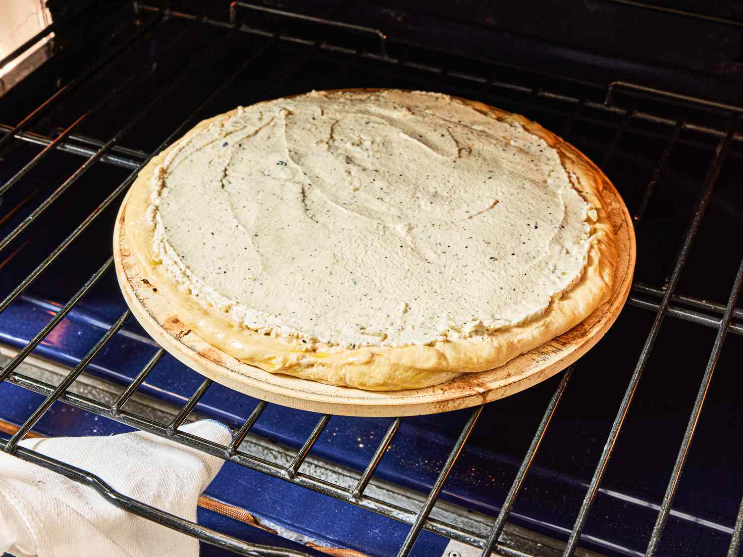 Sliding pizza into oven