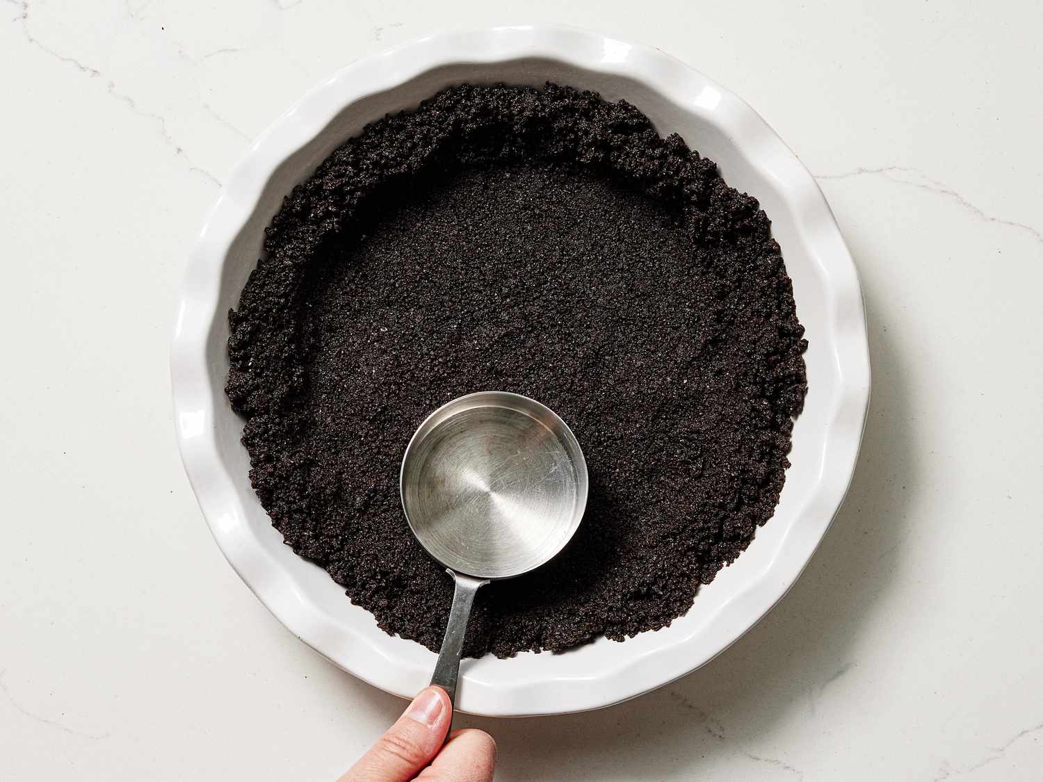 Overhead view of pressing down crust