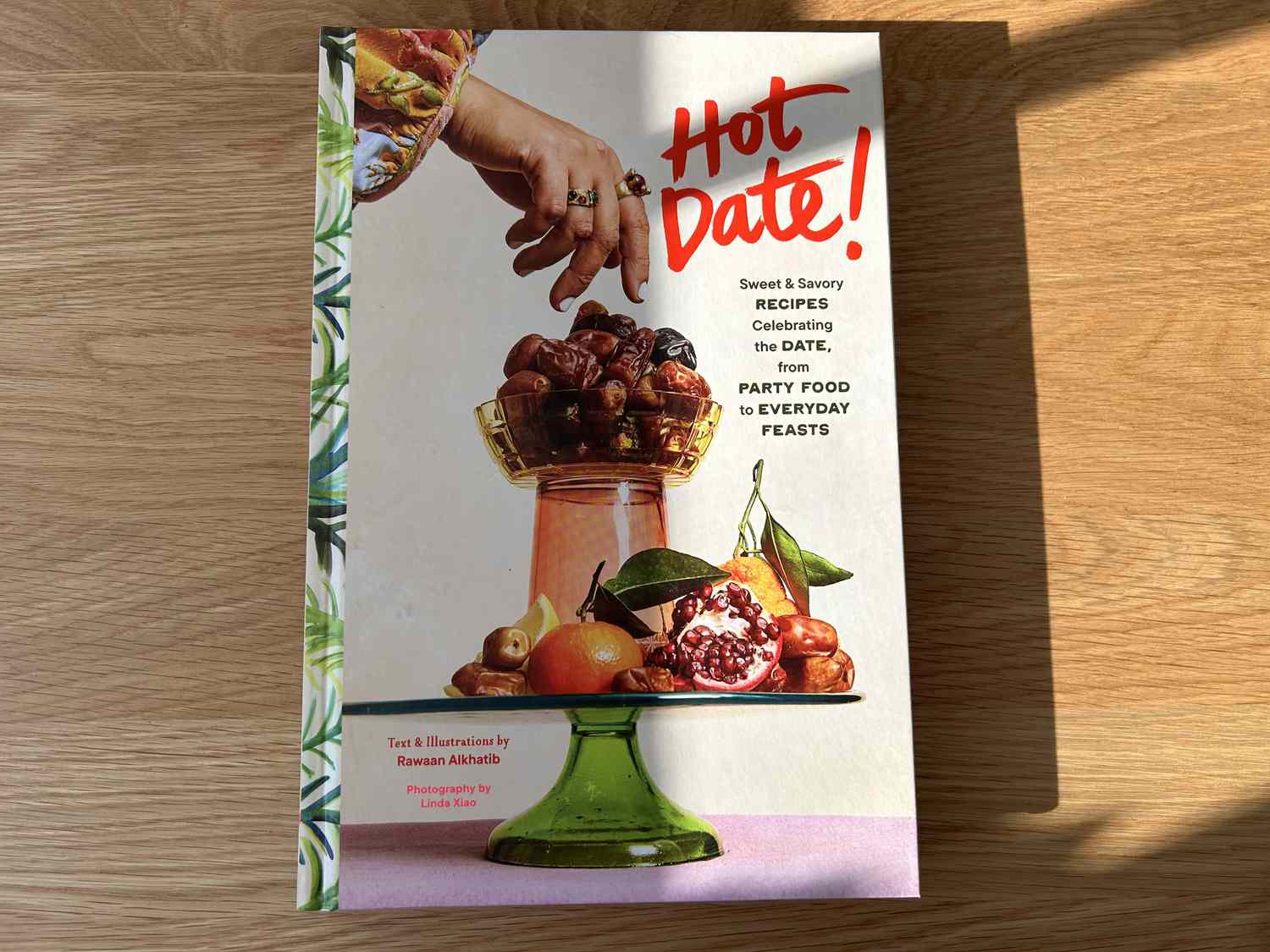 The Hot Date cookbook on a wooden table