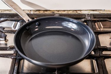 The OXO Non-Stick Pro 10-Inch Frypan on a stove top.