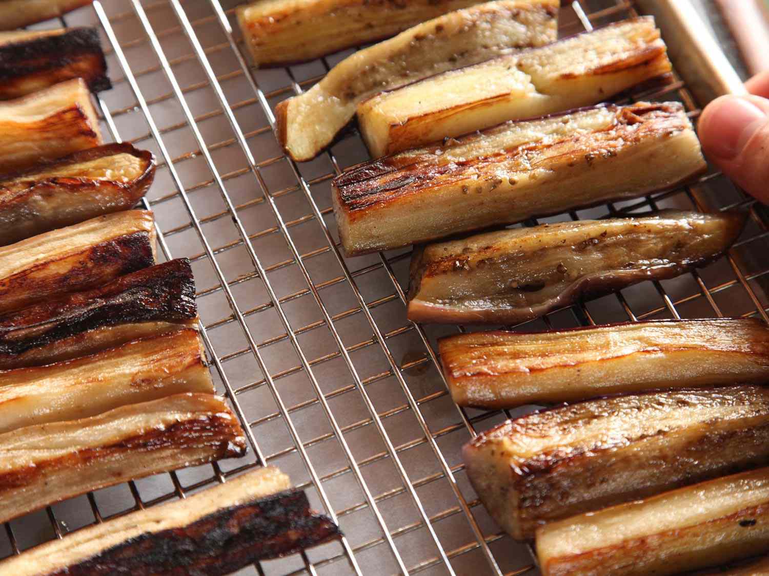 Close-up of fried eggplant on a drying rack.