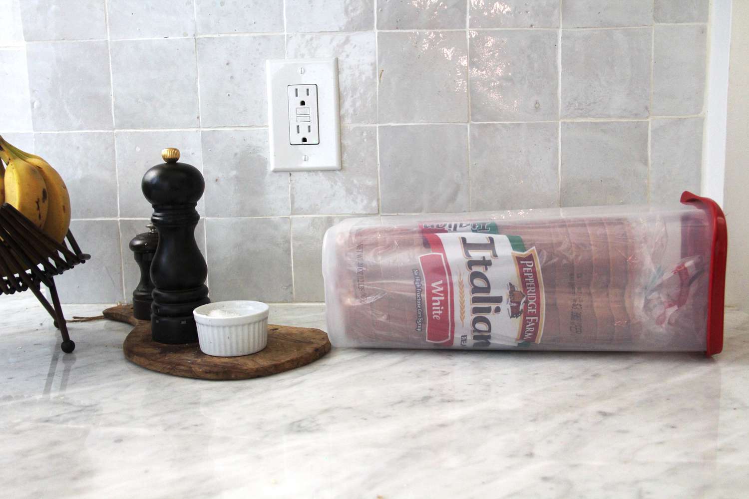 A loaf of bread in the Budeez bread box.