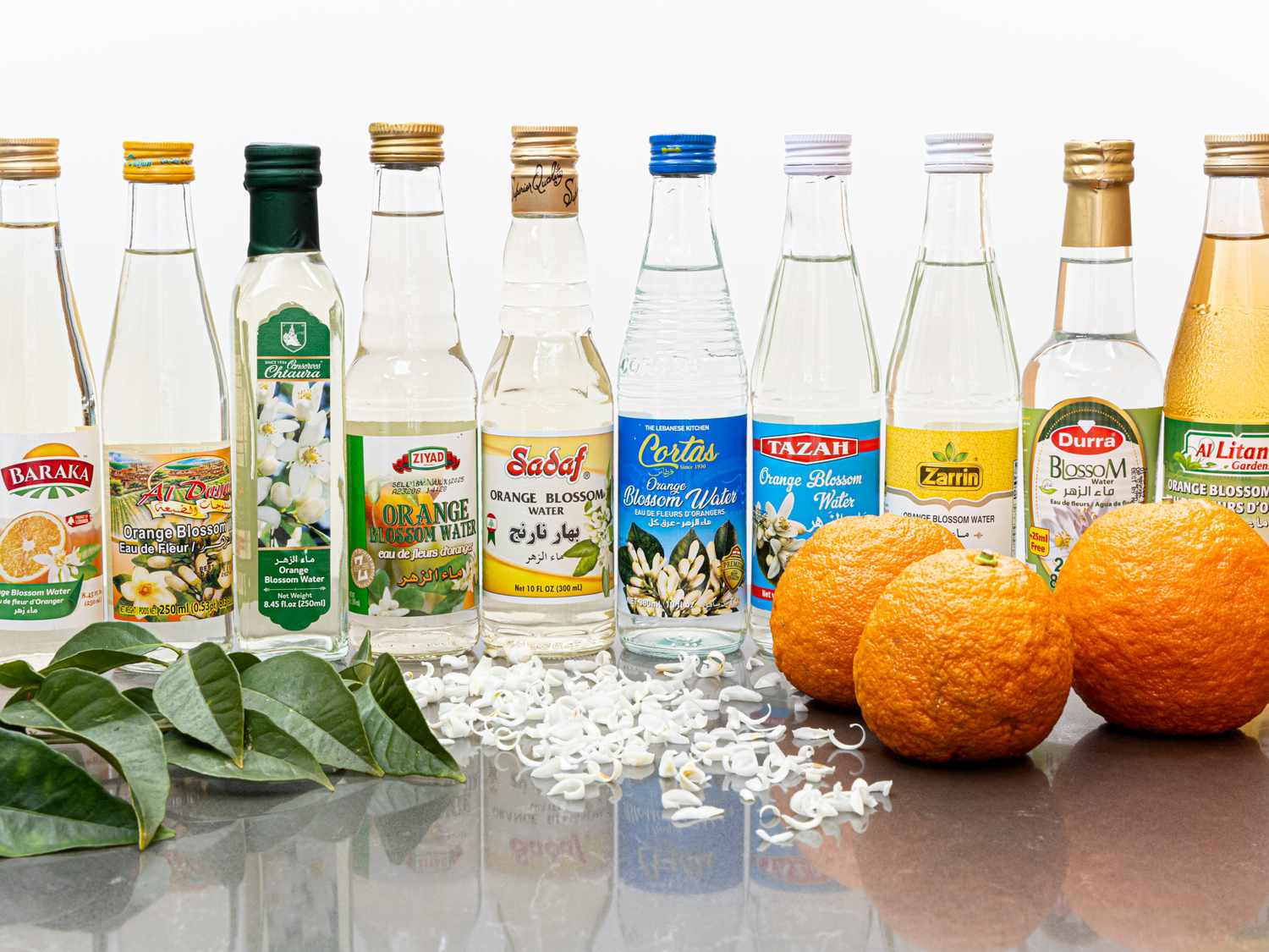 Bottles of orange blossom water and oranges