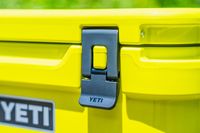 Closeup of the lock on the lid of the Yeti Roadie 48 Rolling Wheeled Cooler