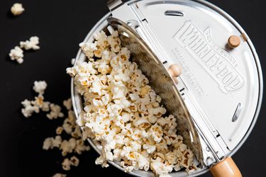 an overhead shot of a Whirley Pop filled with popcorn
