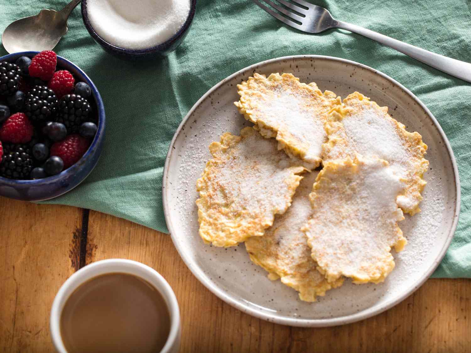 A plate of chremslach, matzo brei pancakes with sugar