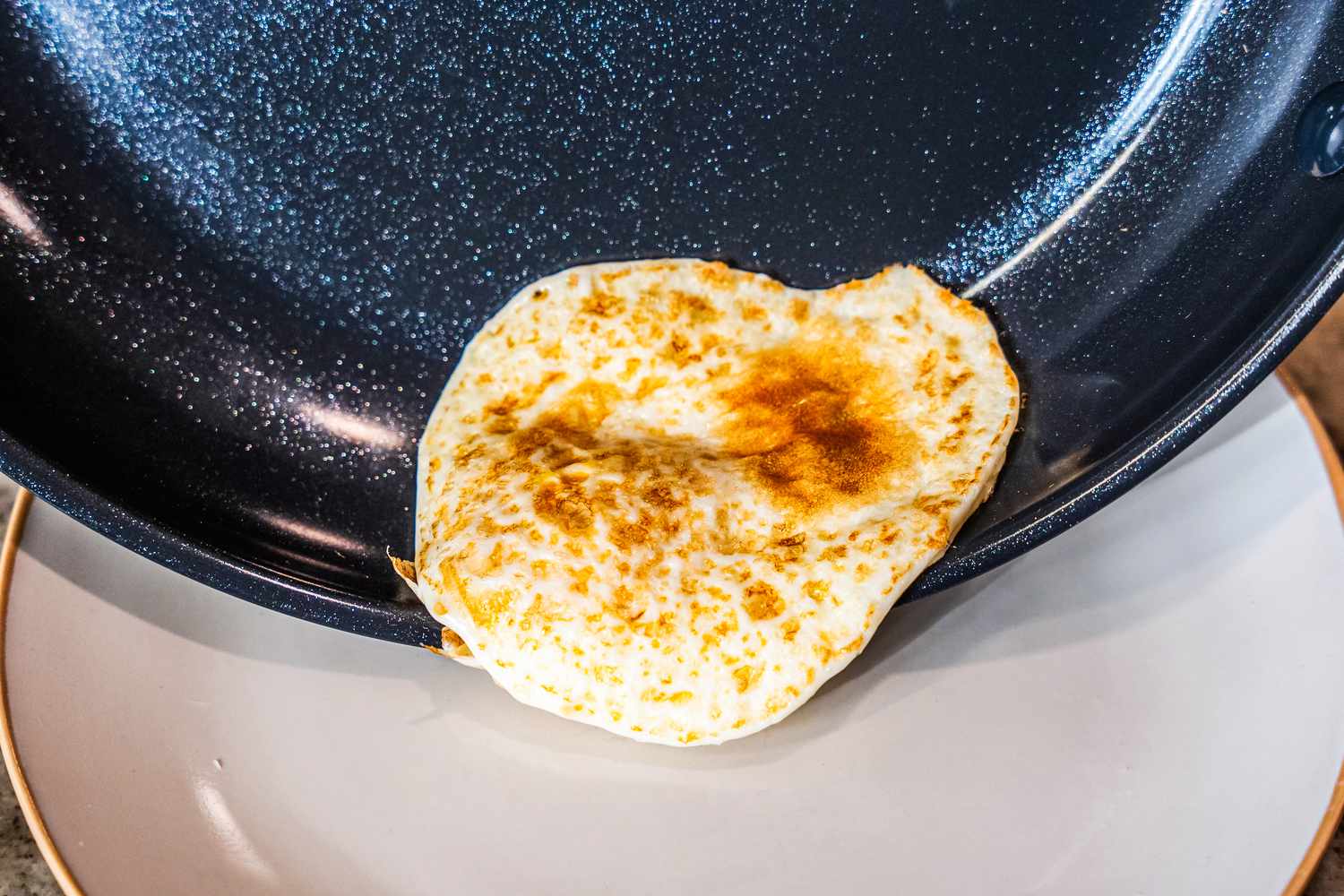 An egg cooked on the OXO Non-Stick Pro 10-Inch Frypan.