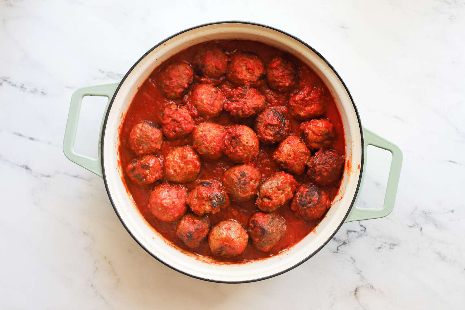 A pot of meatballs in tomato sauce