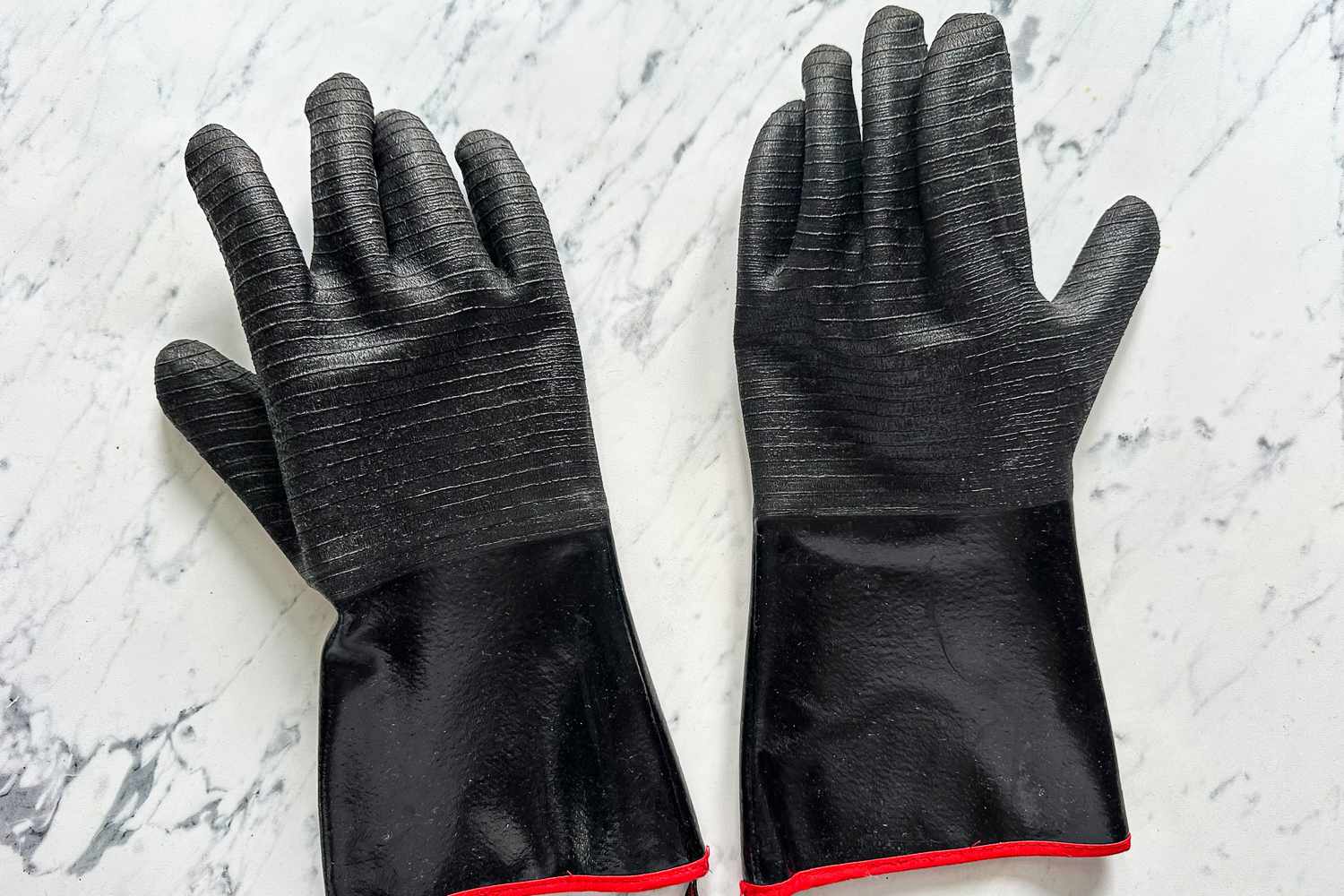 The Grill Armor Gloves BBQ Waterproof Gloves on a kitchen countertop