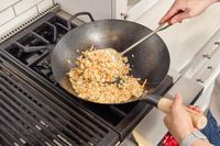 Fried rice is made in the Mammafong Pre-Seasoned Blue Carbon Steel Flat-Bottom Pow Wok