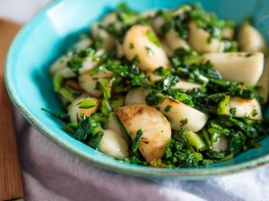 Bowl of sautéed Japanese turnips and greens