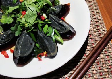 Overhead view of century egg salad, served on a plate.