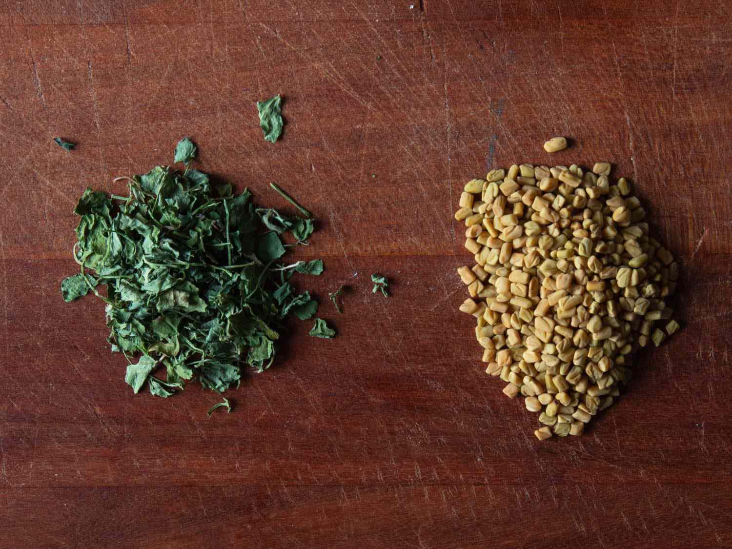 Side by side comparison of fenugreek leaves (left) and fenugreek seeds (right)