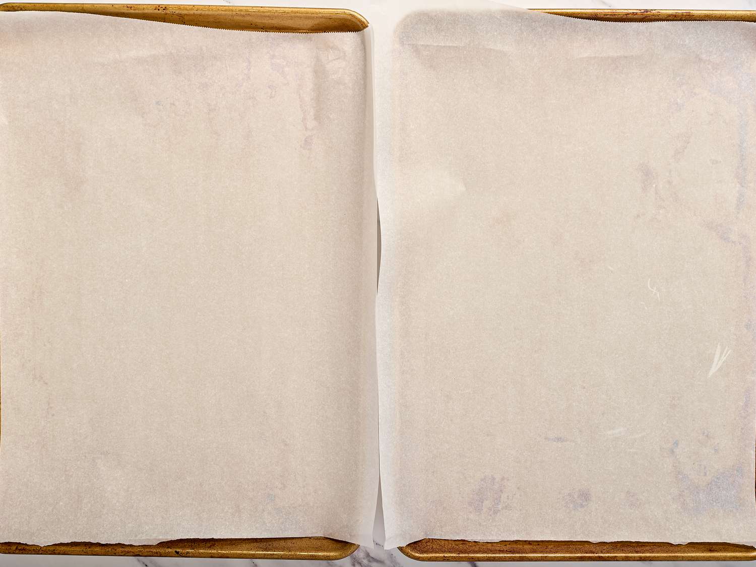Two baking sheets lined with parchment paper