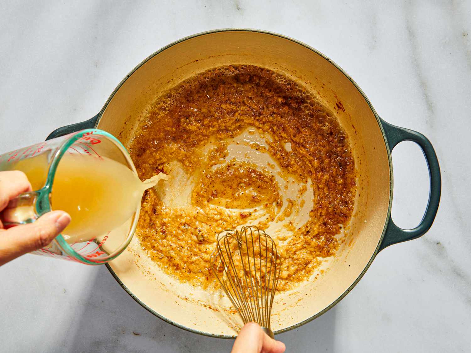 Adding chicken broth into roux in a dutch oven 