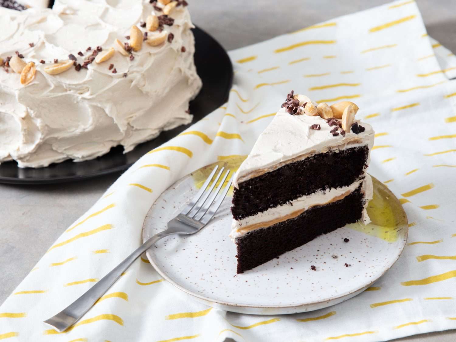 devil's food cake with banana frosting, peanuts, and cocoa nibs