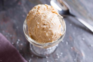 A scoop of vegan salty peanut butter ice cream, an example of foods you can make with canned coconut milk. 
