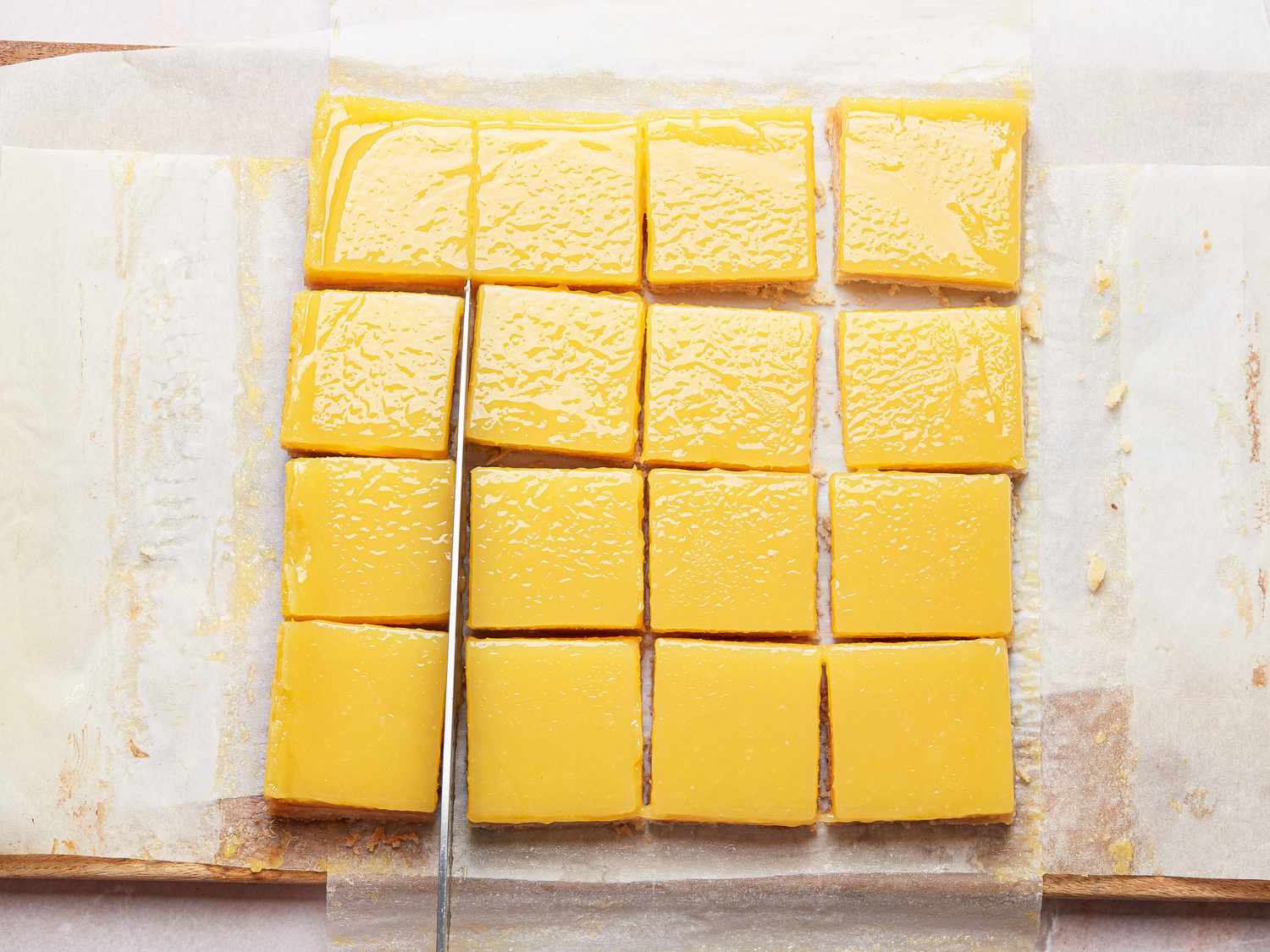 bars cut into squares on a cutting board 