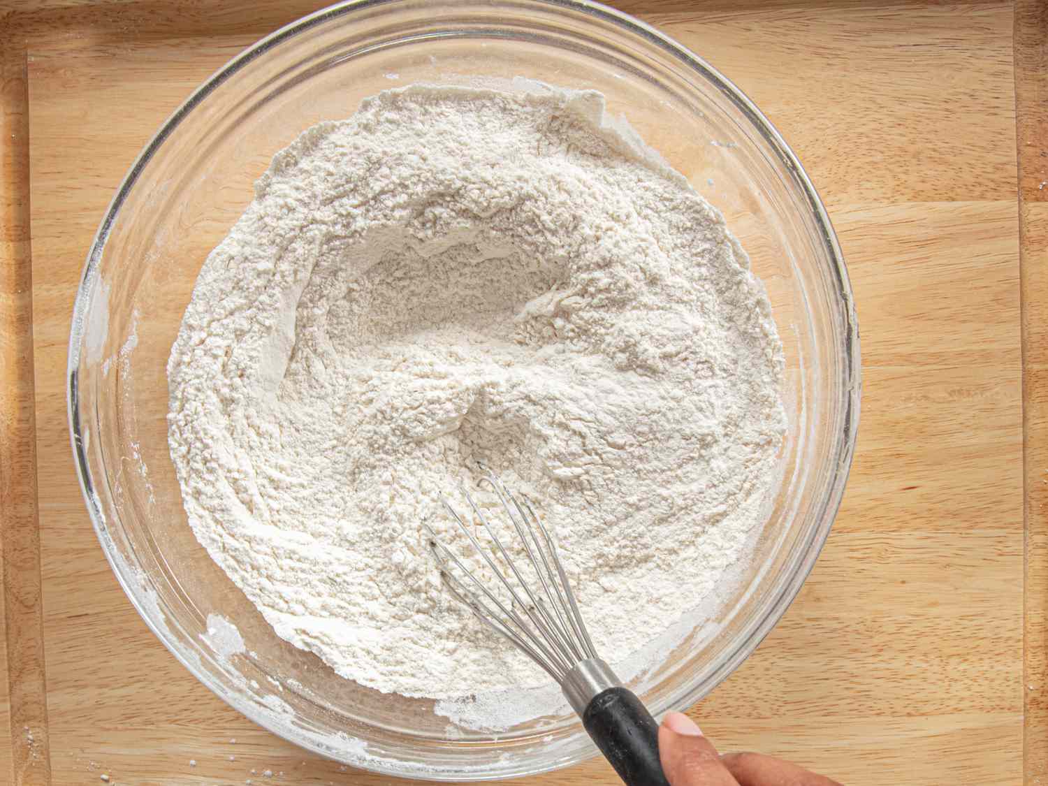 Overhead view of whisking flour mixture together