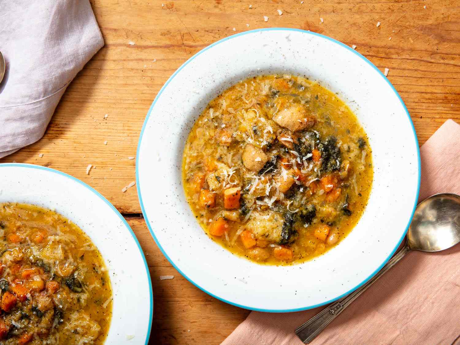 Two shallow bowls filled with Tuscan ribollita made in a pressure cooker