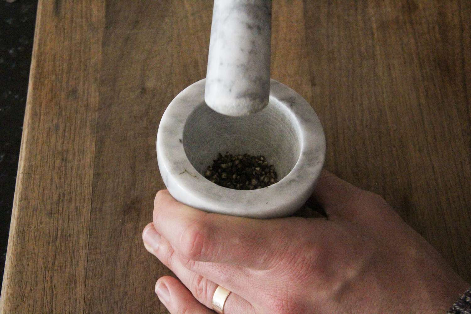 crushing peppercorns with a mini mortar and pestle