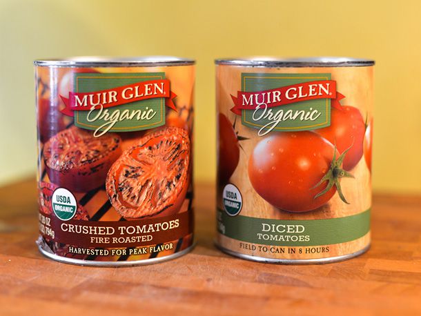 A can of crushed fire-roasted tomatoes and a can of diced tomatoes.