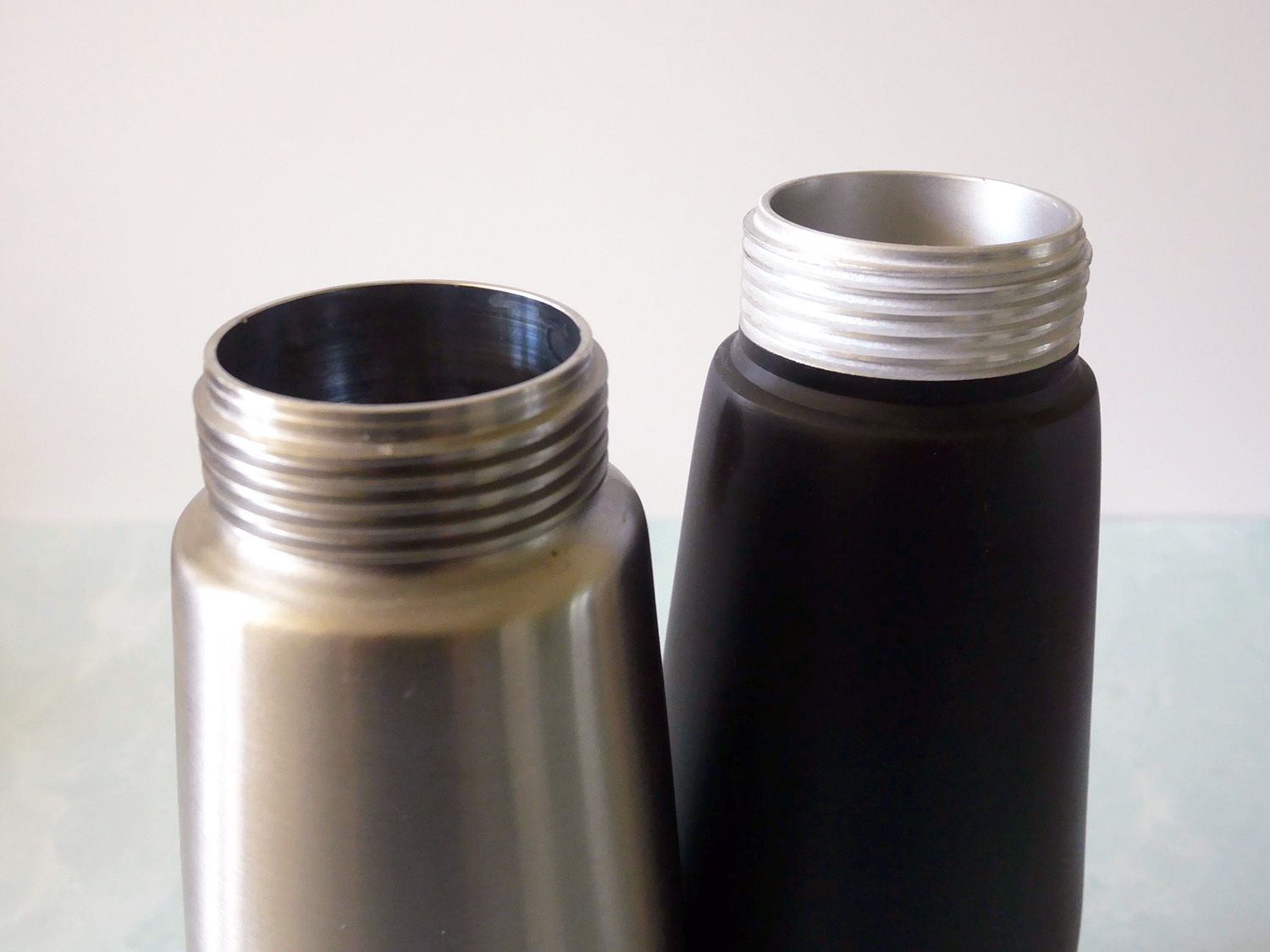 a closeup photo of the threads on the openings of the Kavion and EuroKitchen siphons. 