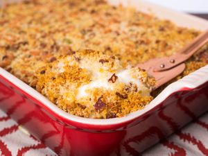 Closeup of potato casserole topped with golden brown panko bread crumbs.
