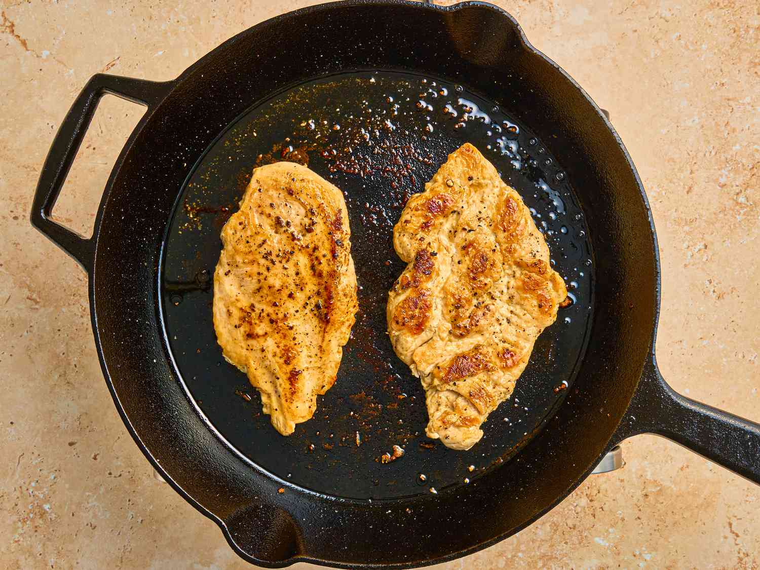 Frying browned chicken on a skillet 