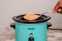 IMUSA 1.5 Quart Slow Cooker beans being scooped out