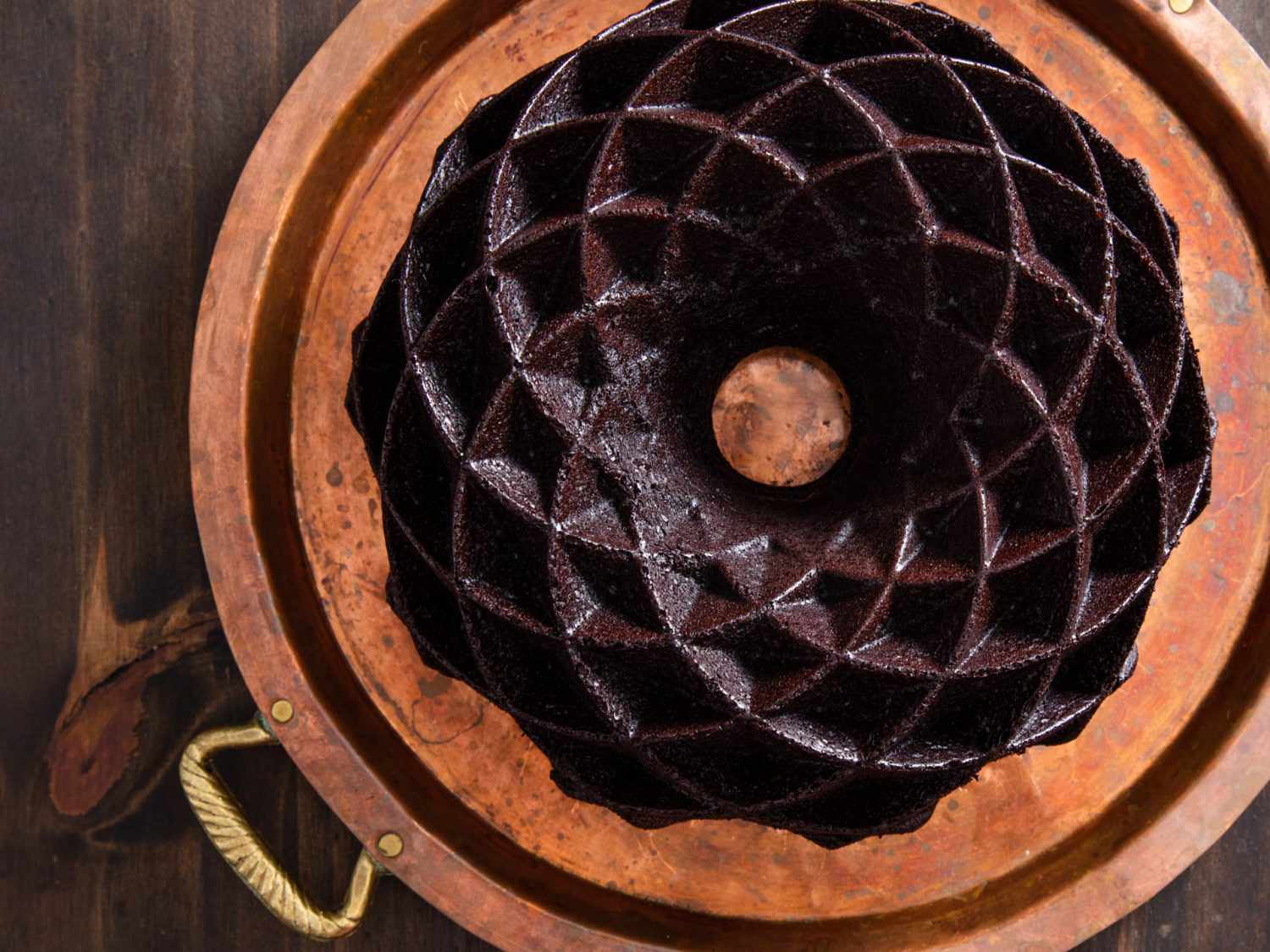 Overhead of a chocolate bundt cake baked in a Nordicware Jubilee bundt pan.