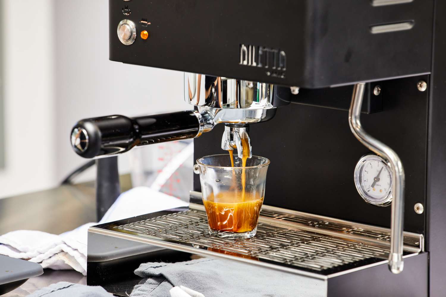 Diletta Mio Espresso Machine brewing an espresso into a glass cup 