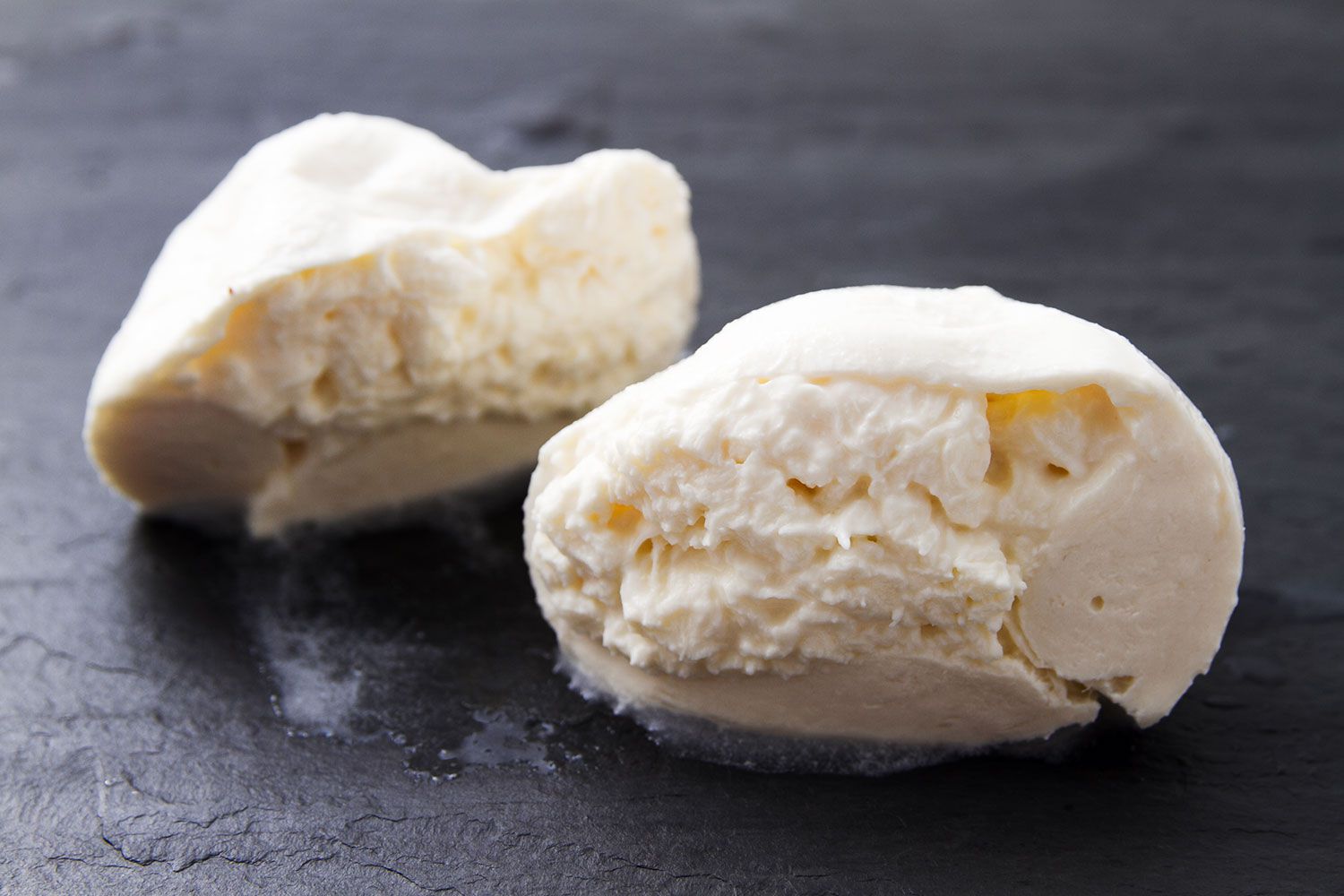 A ball of burrata cut in half.