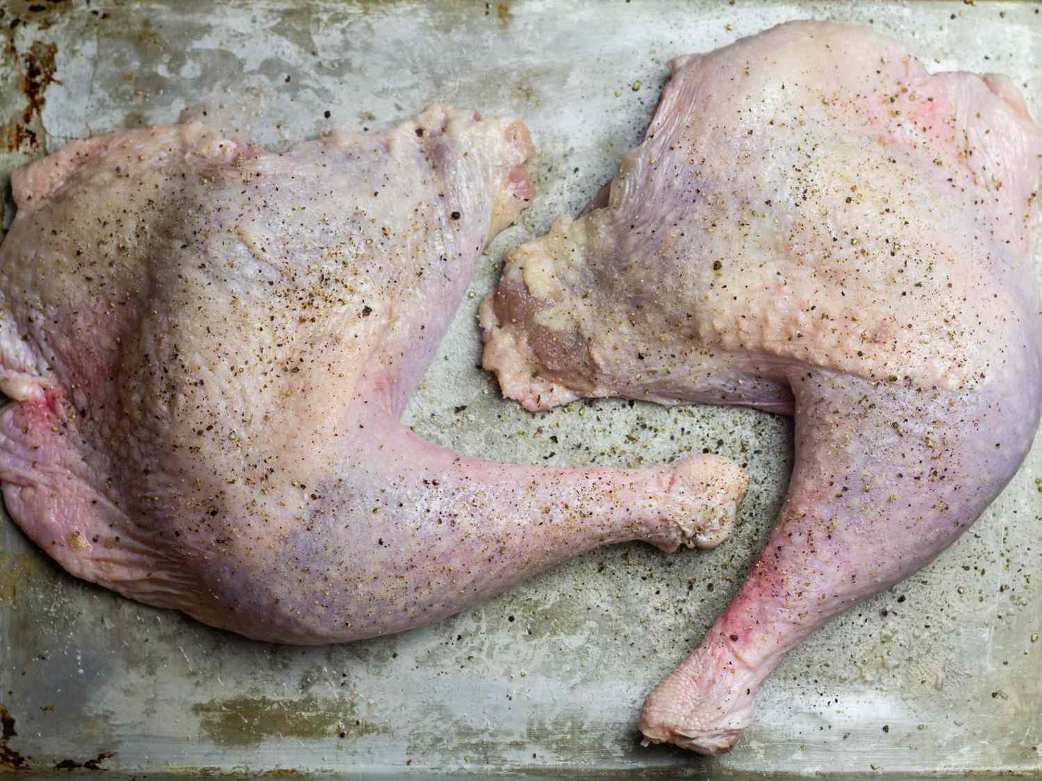 Salt- and pepper-seasoned turkey legs.