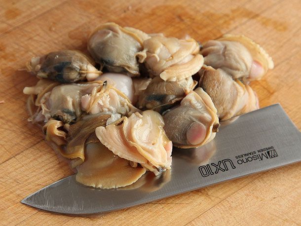 Whole cooked clams removed from shell, ready to be chopped.