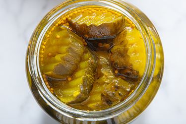 A jar of breadandbutter pickles viewed from above