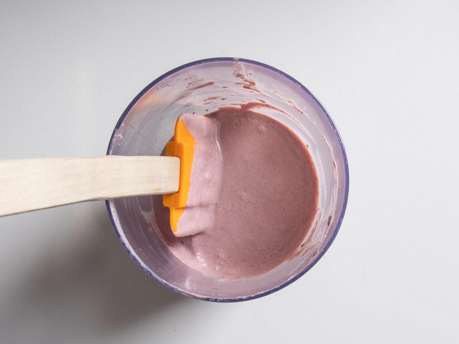 Black-olive sauce in a container, after blending briny black olives into mayonnaise