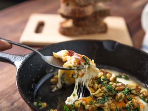 sagnaki with walnut vinaigrette in a cast iron skillet