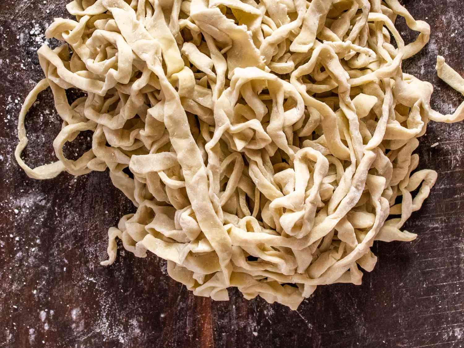 uncooked ramen noodles on a floured surface