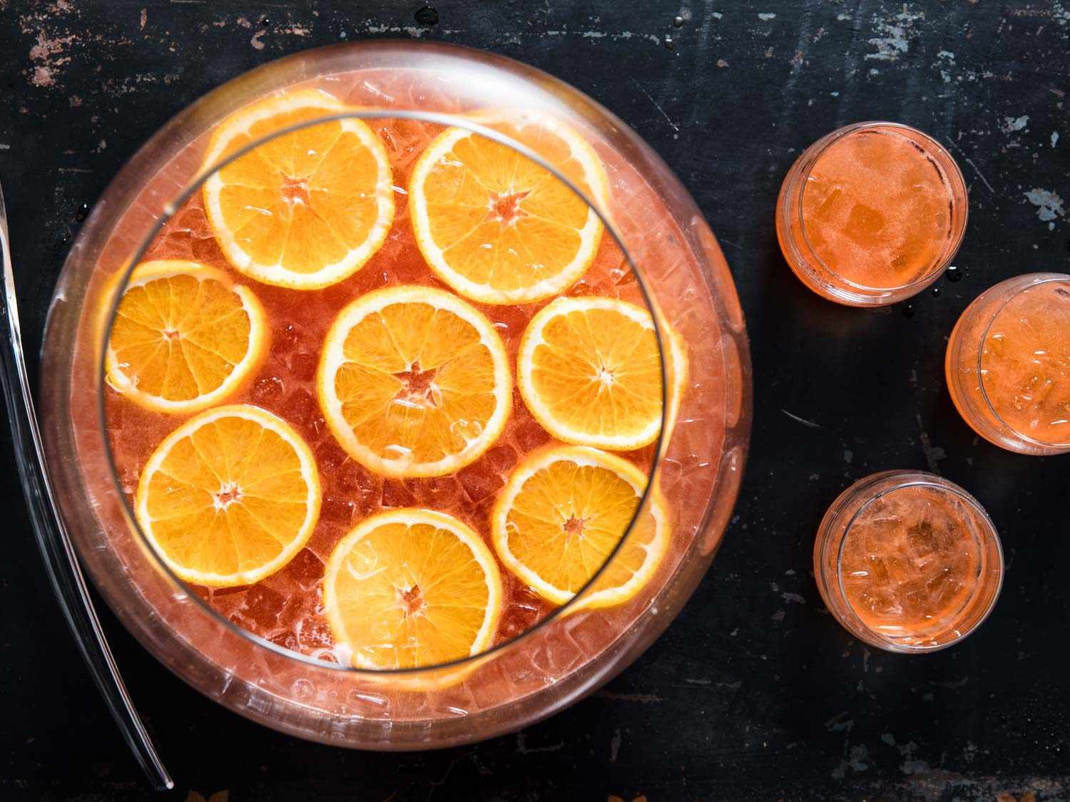 Aperol gin bunch in large punch bowl.