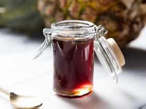 A jar of fresh pineapple syrup.