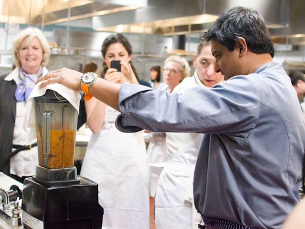 Pureeing the sauce for homemade butter chicken in a blender