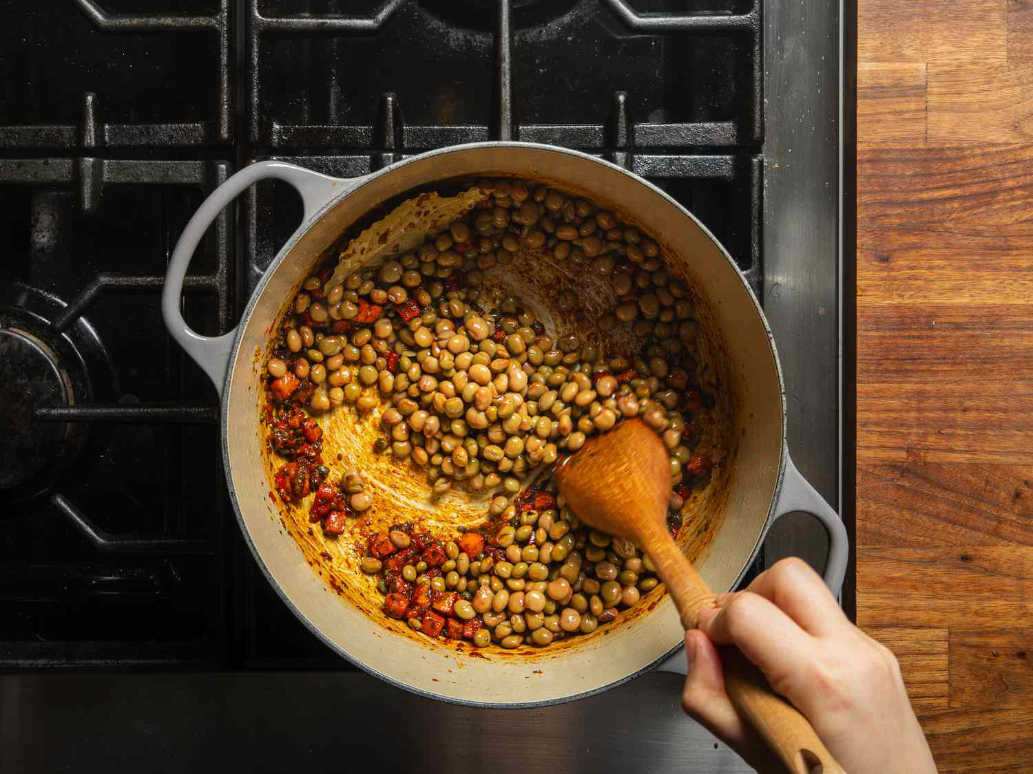 Pigeon peas are added to the pot