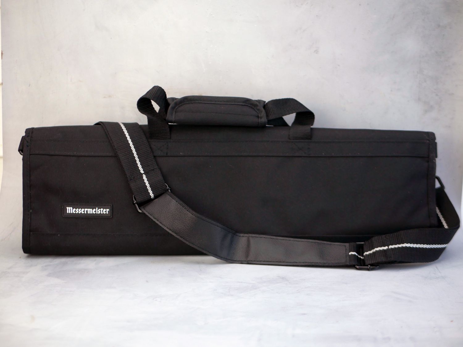messermeister knife roll on a gray surface